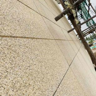 张掖 黄金麻花岗岩荔枝面外墙干挂石材效果示例