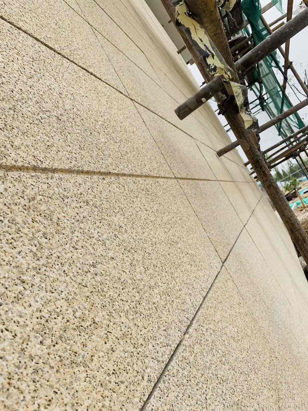 张掖 黄金麻花岗岩荔枝面外墙干挂石材效果示例